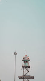 Low angle view of illuminated building against clear sky