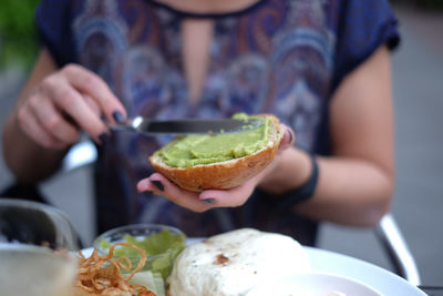 Midsection of woman preparing food