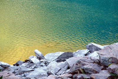 High angle view of rocks on shore