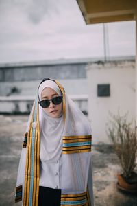 Mid adult man holding boat in sea