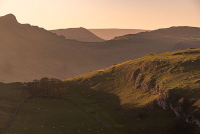 Scenic view of mountains against sky during sunset