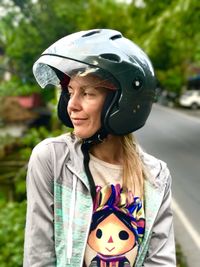 Portrait of smiling woman standing outdoors