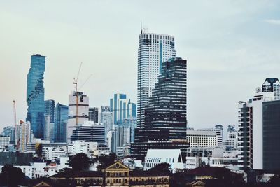 Modern buildings in city against sky