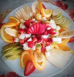 High angle view of chopped fruits in plate