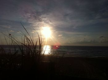 Scenic view of sea against cloudy sky