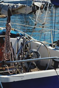 Steering wheel of sailboat in sea