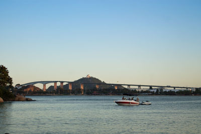 Bridge over river against clear sky