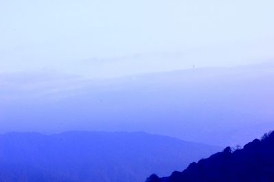 Scenic view of mountains against clear blue sky