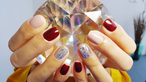 Close-up of woman holding large diamond