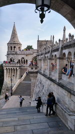 Tourists in front of building