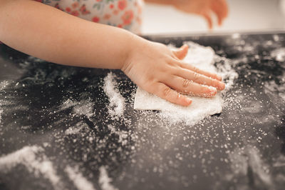 Cropped image of person preparing food at home