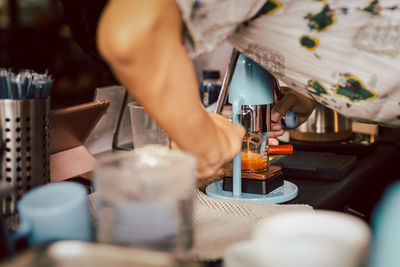 Barista making an extraction of freshly brewed espresso coffee from a leverpresso.