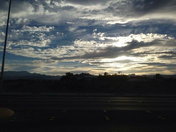 Scenic view of landscape against cloudy sky