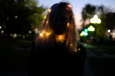 Portrait of woman with illuminated lights