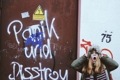 Close-up of graffiti on wall
