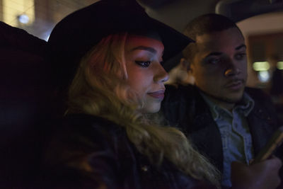 Young couple travelling in a car