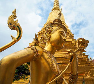 Low angle view of statue against building