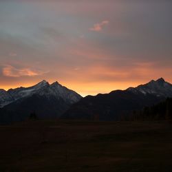 Scenic view of mountains against cloudy sky