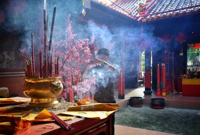 Panoramic view of illuminated temple on table in building