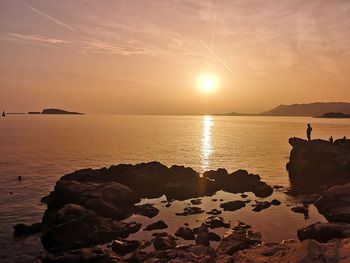 Scenic view of sea against sky during sunset