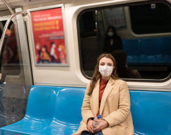 Portrait of young woman in car