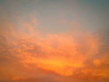 Low angle view of cloudy sky at sunset