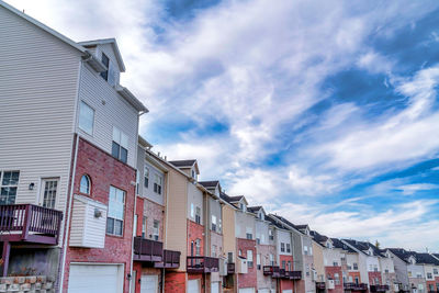 Low angle view of buildings in city against sky