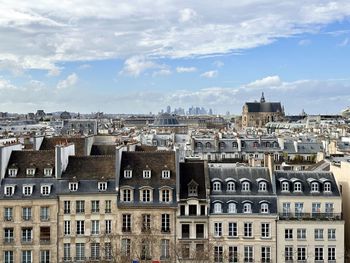 Buildings in city against sky