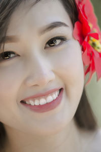 Close-up portrait of a smiling young woman