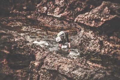 Woman standing on rock