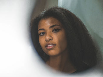 Portrait of young woman looking away