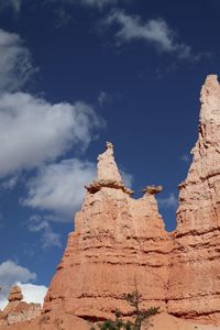 Low angle view of rock formations against sky