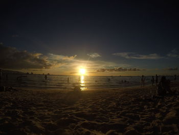 Scenic view of beach against sky during sunset