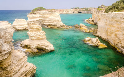 Scenic view of sea and rock formation against sky