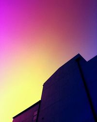 Low angle view of building against sky during sunset