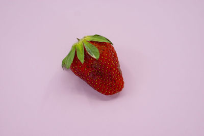 Close-up of strawberry against white background