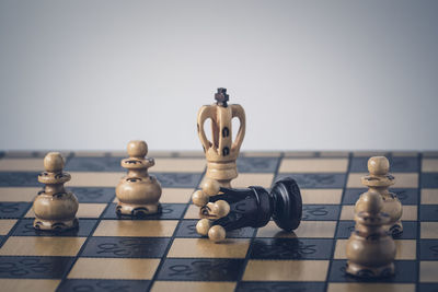 Close-up of chess pieces on table