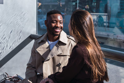 Portrait of smiling young woman outdoors