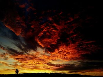 Low angle view of dramatic sky during sunset