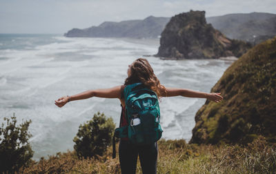 Rear view of woman looking at sea shore