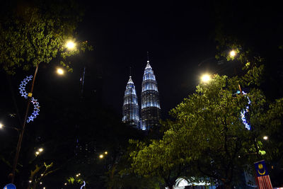 Low angle view of illuminated buildings at night