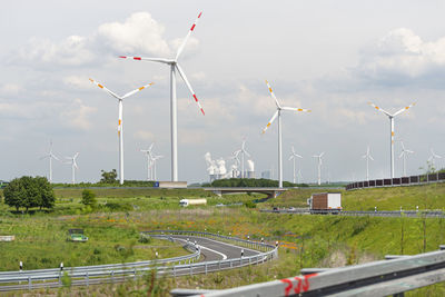 Bonn, germany may 23, 2019. a windmill for electricity production standing in a field along  highway