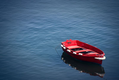 High angle view of red ship moored in water