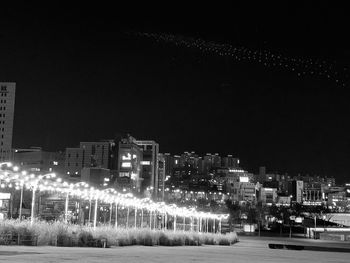 Illuminated buildings in city at night