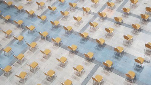 High angle view of chairs on table