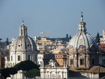 View of buildings in city against sky