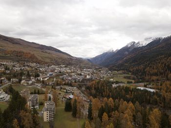 Scenic view of trees and buildings against sky