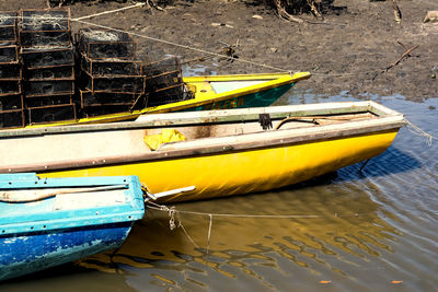 High angle view of yellow boat moored at river