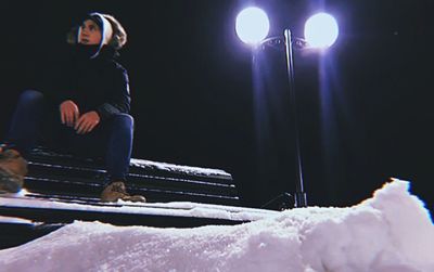 Side view of a boy in the dark