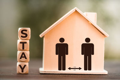 Close-up of toy sign on wood